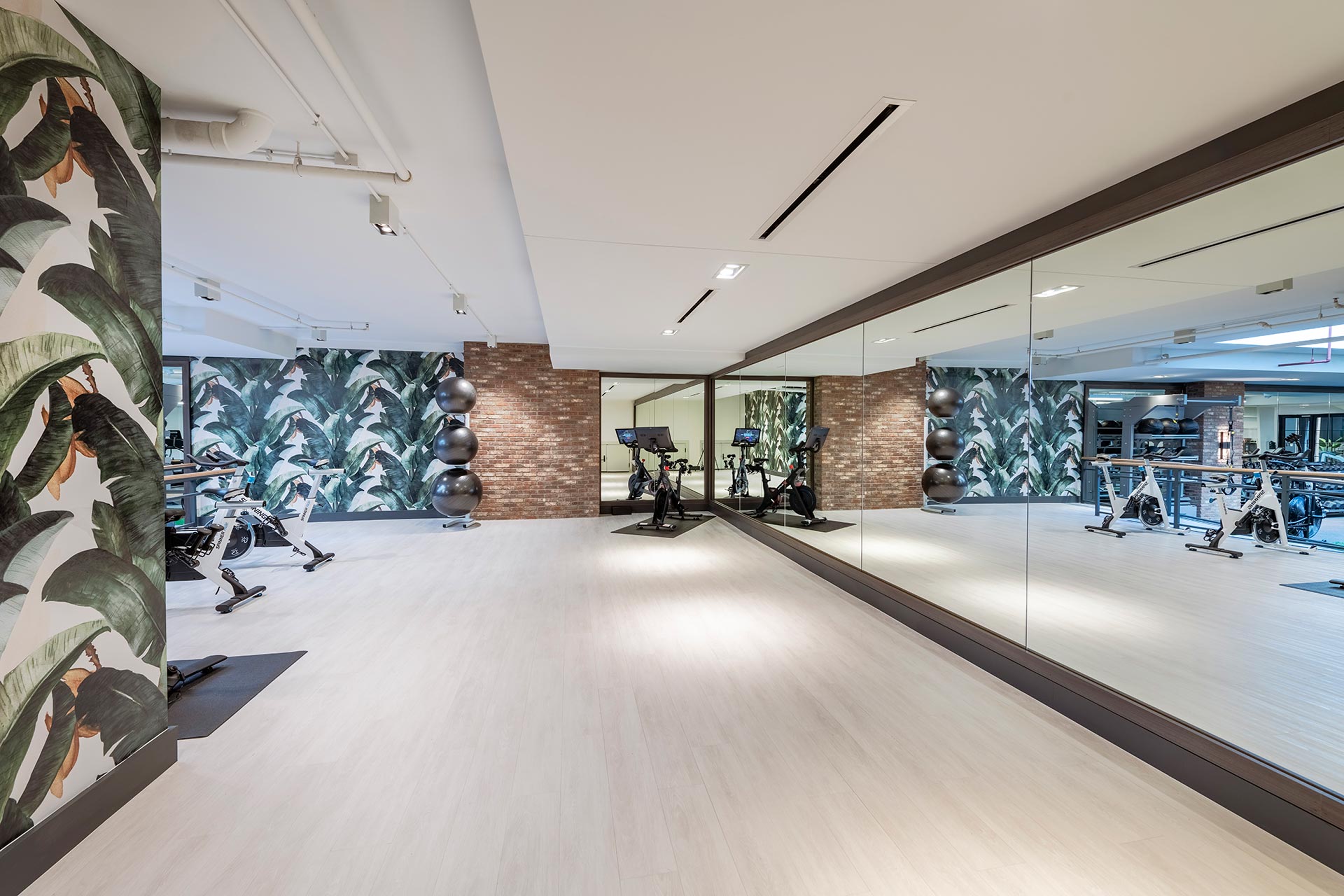 gym with yoga and spin studio area